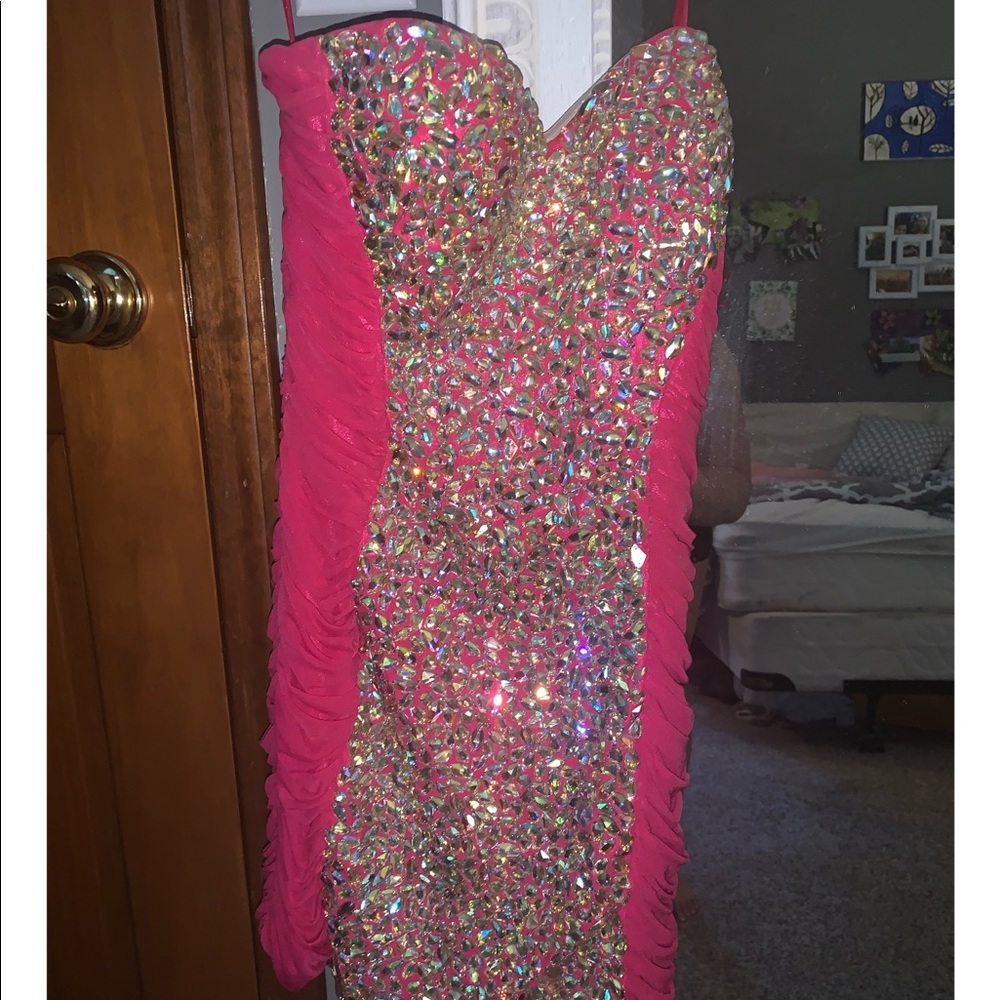 strapless hot pink and bedazzled short dress.